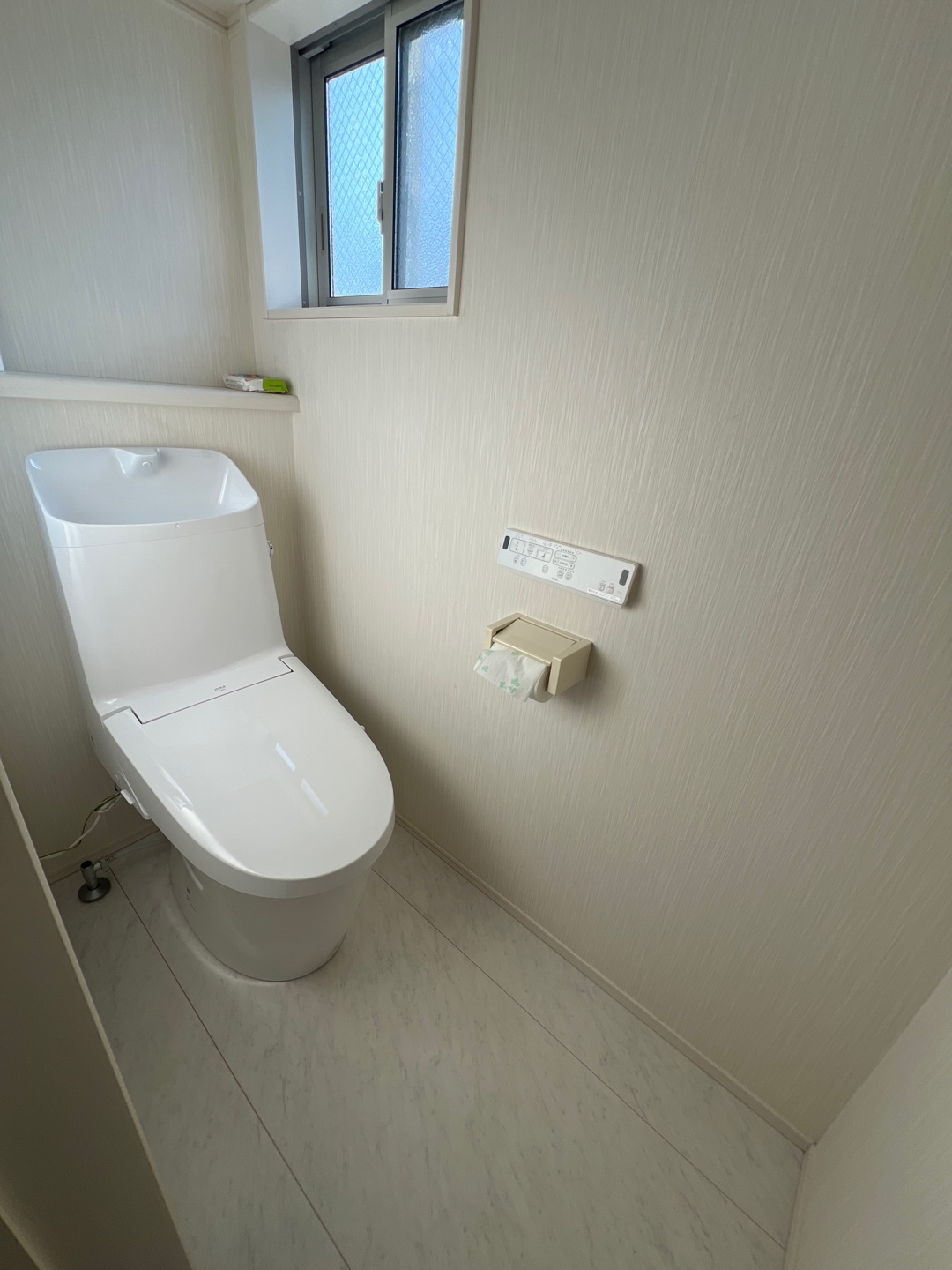 Clean modern toilet room with window