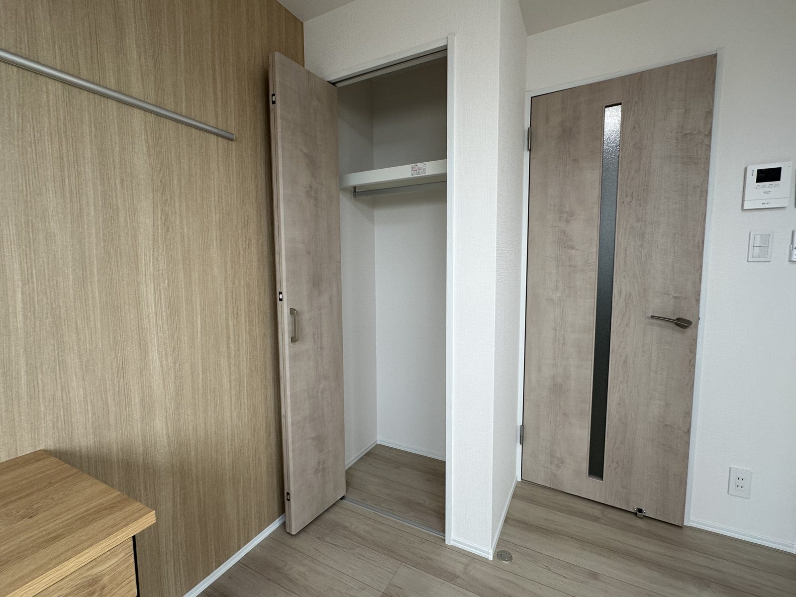 Built-in closet with shelf and hanging rail